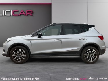 Seat arona 1.0 ecotsi 115 ch start/stop bvm6 xcellence 2eme main radar de recul carplay barre de toit suivi limpide...