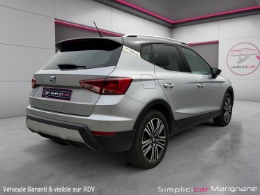 Seat arona 1.0 ecotsi 115 ch start/stop bvm6 xcellence 2eme main radar de recul carplay barre de toit suivi limpide...