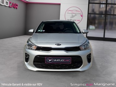 Kia rio 1.0l t-gdi 100 ch isg premium caméra de recul carplay garantie 12 mois occasion simplicicar marignane  simplicicar...
