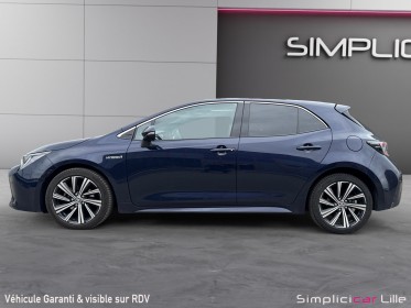Toyota corolla hybride my21 122h design toit ouvrant occasion simplicicar lille  simplicicar simplicibike france