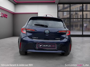 Toyota corolla hybride my21 122h design toit ouvrant occasion simplicicar lille  simplicicar simplicibike france