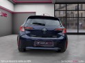 Toyota corolla hybride my21 122h design toit ouvrant occasion simplicicar lille  simplicicar simplicibike france