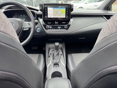 Toyota corolla hybride my21 122h design toit ouvrant occasion simplicicar lille  simplicicar simplicibike france