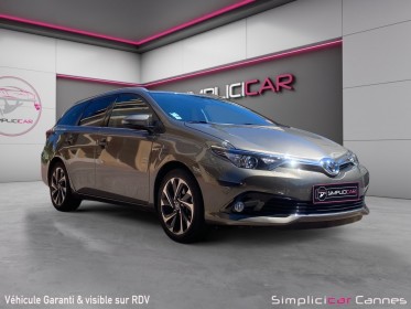 Toyota auris pro rc18 hybride pro 136h design business occasion cannes (06) simplicicar simplicibike france
