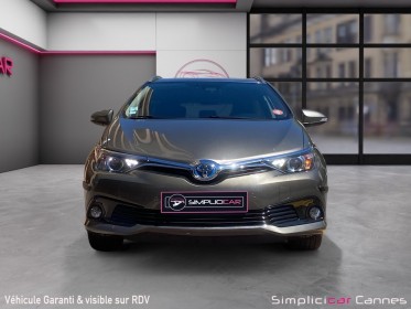 Toyota auris pro rc18 hybride pro 136h design business occasion cannes (06) simplicicar simplicibike france