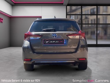 Toyota auris pro rc18 hybride pro 136h design business occasion cannes (06) simplicicar simplicibike france