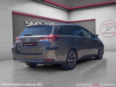 Toyota auris pro rc18 hybride pro 136h design business occasion cannes (06) simplicicar simplicibike france
