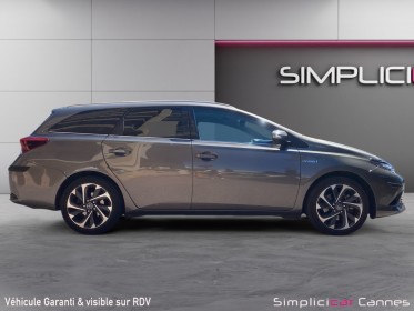 Toyota auris pro rc18 hybride pro 136h design business occasion cannes (06) simplicicar simplicibike france