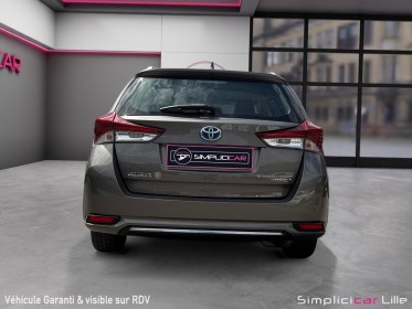 Toyota auris touring sports hybride 136h dynamic occasion simplicicar lille  simplicicar simplicibike france