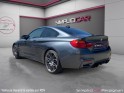 Bmw m4 coupe f82 450 ch pack competition m dkg7 car play / supp. silencieux / toit et diffuseur carbone / suivi entretien...
