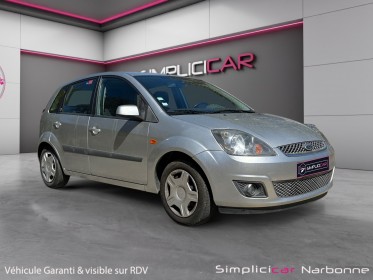 Ford fiesta 1.4 tdci ghia durashift a clim retro rabattable garantie 12 mois occasion simplicicar narbonne simplicicar...