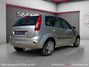 Ford fiesta 1.4 tdci ghia durashift a clim retro rabattable garantie 12 mois occasion simplicicar narbonne simplicicar...