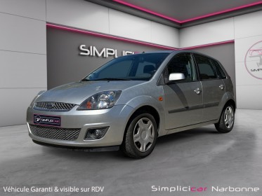Ford fiesta 1.4 tdci ghia durashift a clim retro rabattable garantie 12 mois occasion simplicicar narbonne simplicicar...