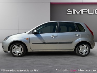 Ford fiesta 1.4 tdci ghia durashift a clim retro rabattable garantie 12 mois occasion simplicicar narbonne simplicicar...
