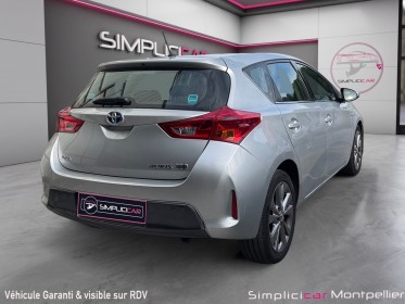 Toyota auris hybride 136h dynamic garantie 12 mois occasion montpellier (34) simplicicar simplicibike france