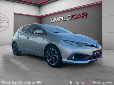 Toyota auris 136ch dynamic hybride garantie 12 mois occasion montpellier (34) simplicicar simplicibike france