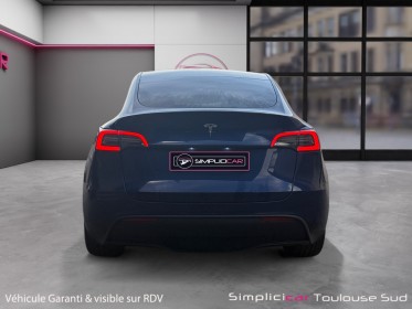 Tesla model y standard rwd caméra de recul sièges électriques et chauffants garantie constructeur 11/2028 occasion...