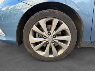 Toyota auris touring sports hybride 136h design/entretien a jour/garantie 12 mois occasion paris 17ème (75)(porte maillot)...